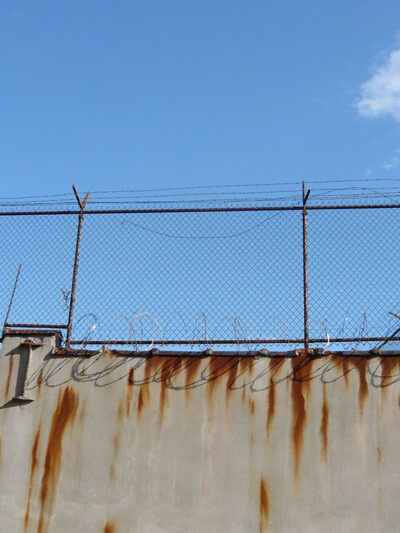 Barbed wire fence outside prison