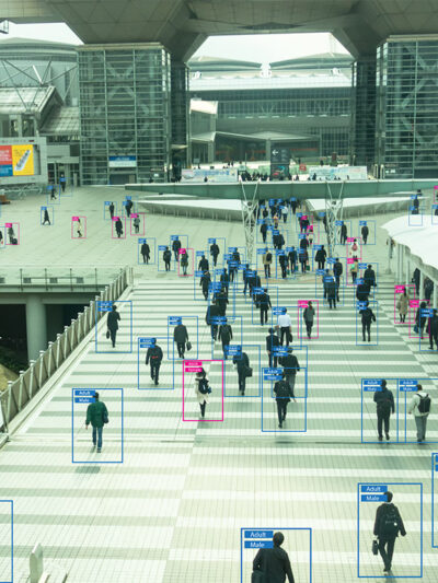View of people from afar with human recognition markers around them