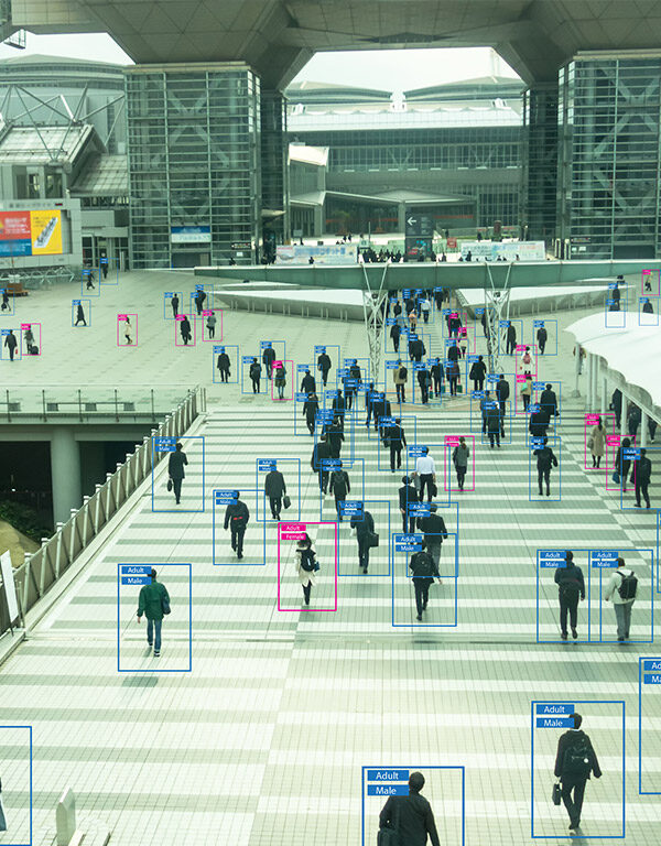 View of people from afar with human recognition markers around them