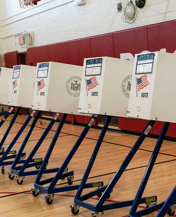 Voting booths lined up at polling station during in a public school in Brooklyn, New York.